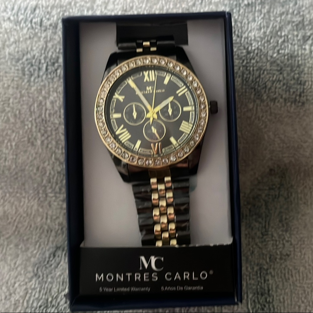 Luxurious Black and Gold Watch with Sparkling Bezel